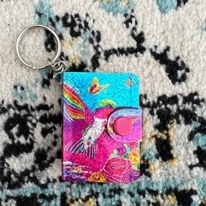 Lisa Frank Dashly keychain notepad.